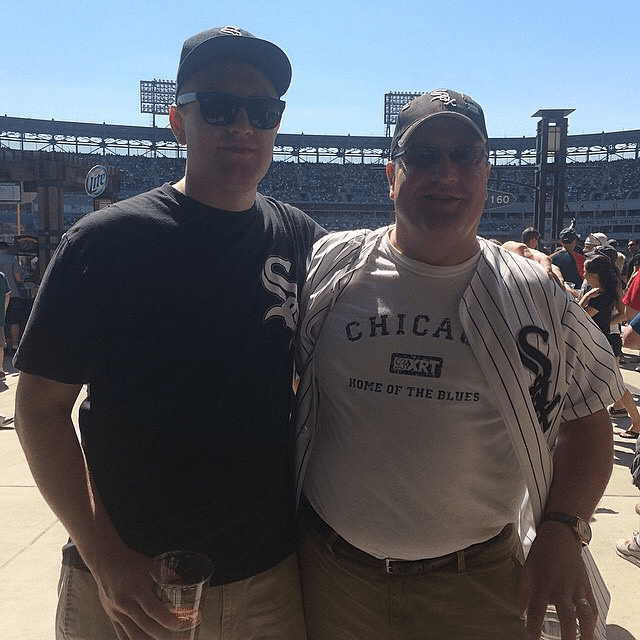 Drew and his dad on the concourse at Guaranteed Rate Field